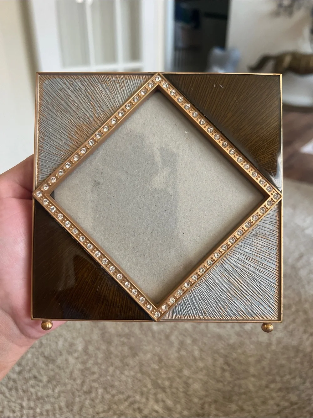 Z Gallerie picture frame features an enamel and crystal-decorated diamond border